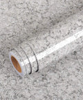 Roll of Granite Look Countertop Contact Paper Peel and Stick Vinyl Wrap, 15.8 x 394 Inches, placed on a matching surface.