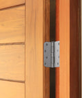 Four Inch Satin Nickel Interior Door Hinges Two Pack on a wooden door, showcasing smooth action and durable steel build.