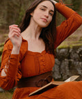 Dope Renaissance Obi Belt With Snatched Medieval Leather Corset Style Game Changing Wide Cinch Strap worn with an orange dress.
