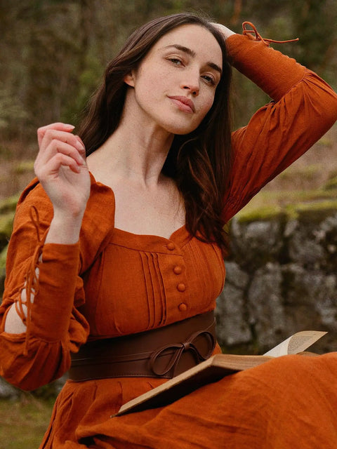 Dope Renaissance Obi Belt With Snatched Medieval Leather Corset Style Game Changing Wide Cinch Strap worn with an orange dress.