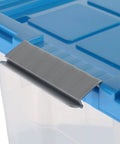 Close-up of Heavy Duty Rolling Storage Bin With Secure Lid And Smooth Ride Wheels, showing secure gray clip on lid.