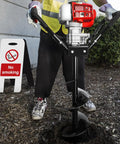 Person operating gas powered earth auger with 6 inch digger bit for post holes and tree planting, 2 stroke engine, heavy duty