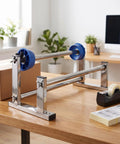 Adjustable Tabletop Stretch Film Dispenser With Cutter Lightweight Metal And Plastic Build Manual Hand Wrap Tool For Cargo And Pallet Wrapping Easy Grab And Go One Hand Operation For Quick Pack Jobs on desk with tape and box