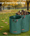 Large green reusable leaf bags filled with garden debris, shown in a park setting with fallen leaves on the ground.