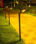 4-Pack 150 Lumen Solar Pathway Lights Waterproof Landscape Lighting illuminating a garden walkway at night