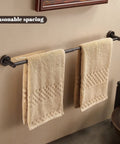Adjustable Bronze Towel Bar 15 To 24 Inches, Wall Mounted Towel Rack For Bathroom, Oil Rubbed Finish holding two beige towels