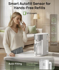 Woman using Countertop Reverse Osmosis Water Filter With 7 In 1 Purification, Auto Fill Pitcher on kitchen counter