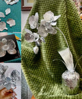 Silver flowers crafted from Gold Tin Foil Craft Kit with 15 dual-sided aluminum foil sheets on display