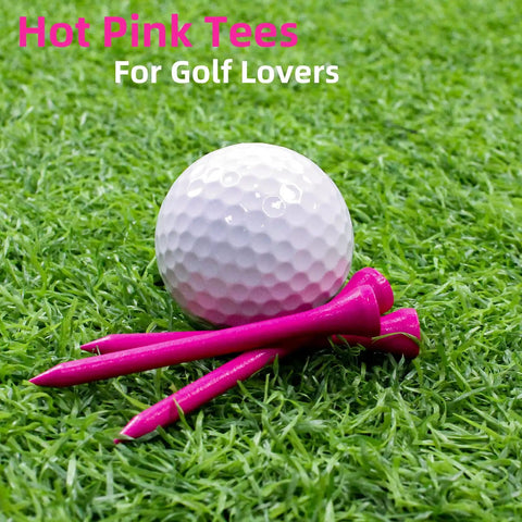 Pink Bamboo Golf Tees Three And A Quarter Inch 100 Pack Solid Bamboo Tees For Women And Girls with golf ball on grass