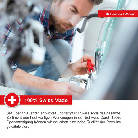 Person using Swiss Grip Starby Coin Driver With Red Handle, 45 mm Shaft, 100 mm Total Length, for bike repair.