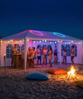 Outdoor White Waterproof Gazebo Tent With Removable Sidewalls And Windows Ten By Twenty Feet Heavy Duty Event Shelter for beach party at night.