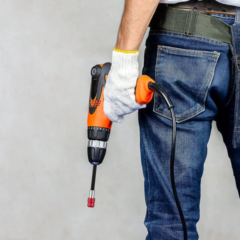 Person holding drill with Six Piece Magnetic Drill Bit Extension And Screwdriver Bit Holder Set For Impact Drivers And Drills in use.