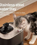 Cat drinking from a cordless battery operated cat water fountain with 2.5L capacity 84oz stainless steel tray BPA free easy to clean