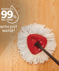 Heavy Hitter Microfiber Spin Mop And Bucket Set Including Three Extra Washable Replacement Pads For Fast Dirt Trapping And No Sweat Floor Mopping Quick Dry Finish On Hardwood on wooden floor.