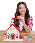 Child using Snoopy House Snow Cone Machine For Kids Hand Crank Shaved Ice Maker With Fruit Punch Flavor Pack Easy Setup Summer Cooling Toy.