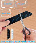 Person cutting reusable rug gripper set for hardwood floors and carpet, thin yet highly adhesive, removable rug tape.