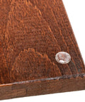 Close-up of a wooden cabinet door corner with a clear door bumper attached, used with Half Inch Overlay Matte Black Cabinet Hinges Self Closing For Bath And Kitchen Bulk Pack 50 Hinges 25 Pairs Flush Mount With Door Bumpers And Upgraded Screws Easy Install And Quiet Close For Home Improvement.