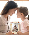 Mother and daughter holding a decorated frame from 6 Unfinished Wood Picture Frames DIY Kit With 4 By 6 Inch Photos, A Fun DIY Craft Pack For Adults
