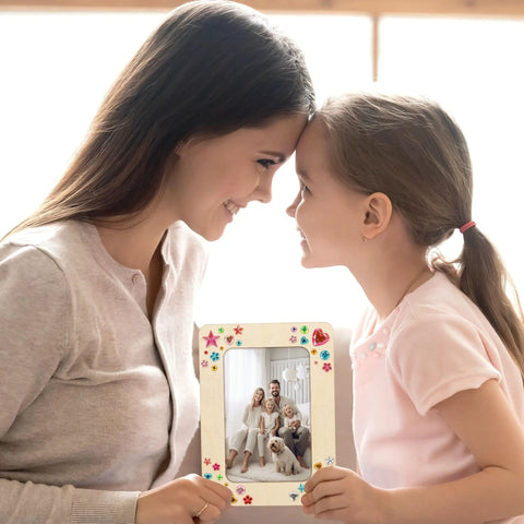 Mother and daughter holding a decorated frame from 6 Unfinished Wood Picture Frames DIY Kit With 4 By 6 Inch Photos, A Fun DIY Craft Pack For Adults