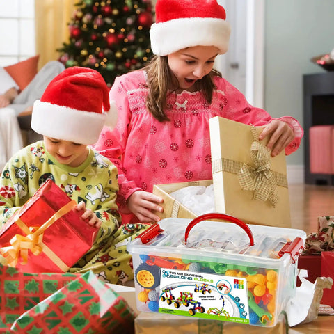 Children opening gifts with Epic 170 Piece Building Set For Kids Ages 3 To 9 With Toy Box Storage and Idea Guide, Christmas scene