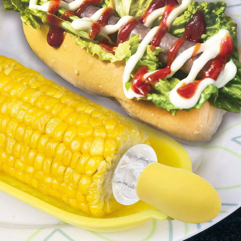Twin Prong Corn Cob Holders And Butter Spreader Set For Barbecue displayed with corn on the cob and hot dog