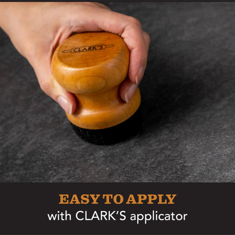 Applying Natural Stone Wax Sealant Pro Grade for Soapstone with applicator, showing ease of use and non-greasy application.