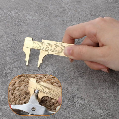 Brass Pocket Vernier Caliper Set With 3.15 Inch And 3.94 Inch Mini Sliding Calipers, hand holding tool for jewelry measurement.