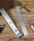 Four Pack 12 Inch Stainless Steel Strap Hinges Heavy Duty Gate Hardware For Sheds Barns And Swing Doors Silver Finish on wooden surface.
