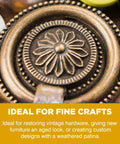 Front close-up of antique brass doorknob with floral center and beaded edge