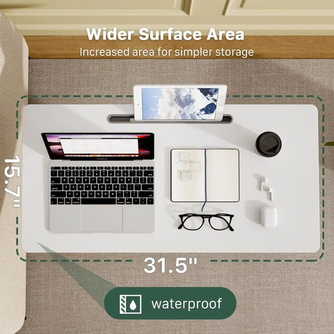 Top view of Mobile Standing Desk With Pneumatic Height Adjustment, showcasing 31.5” wide waterproof surface with laptop and tablet.