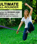 Woman balancing on BananaLama XL Slackline With TreeWear Do It All Slack Line Kit Eighty Two Feet By One Point Five Inch Width