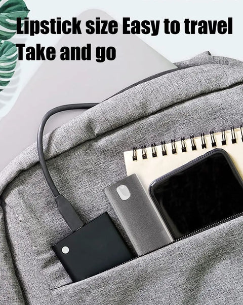 Close-up of a backpack pocket with a notebook, smartphone, and portable power bank, showcasing easy travel size.