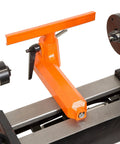 WEN LA3424 benchtop wood lathe with orange tool rest on black bed