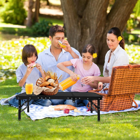 Foldable Camping Table With Storage Net Aluminum Portable Table for picnics, set with food and family in park