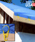 15 Pack Tarp Clips For Outdoor Camping And Shelter Setup To Hold Tents Awnings Tarps Banners And Covers With Beefy Grip And Easy Grommet Replacement Made In The USA holding a blue tarp on a wooden roof structure