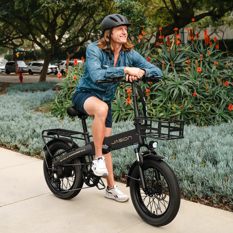 Person on Foldable 20 Inch Fat Tire Electric Bike For Adults With 1200W Peak Motor And 48V Battery, black aluminum frame
