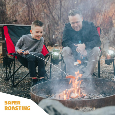 Father and son using 45 Inch Extra Long Marshmallow Roasting Sticks Kit For Campfire Smores, 4 Pack Telescoping Skewers.