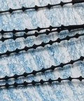 Heavy Duty Premium Black 5 Inch Adjustable Security Beaded Loop Ties For Clothing And LuggagE Quick Snap Pin Fasteners Bulk 1000 Pack close-up view.