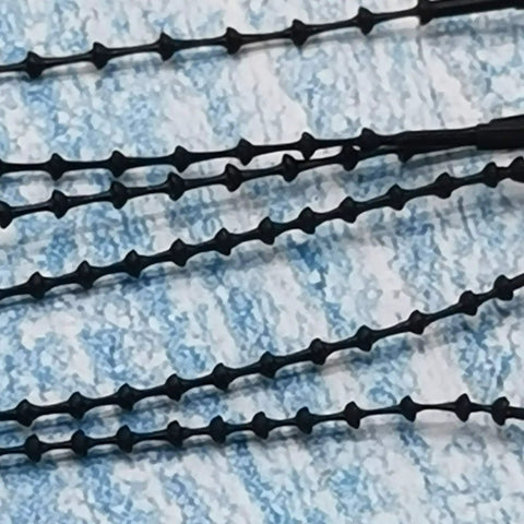 Heavy Duty Premium Black 5 Inch Adjustable Security Beaded Loop Ties For Clothing And LuggagE Quick Snap Pin Fasteners Bulk 1000 Pack close-up view.