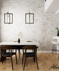 Woodburn One Light Pendant Light In Brushed Nickel Dimmable Modern Rectangle Fixture hanging in a dining room