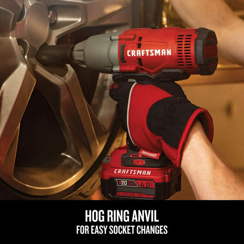 Using Beast Half Inch Cordless Impact Wrench Bare Tool With Hog Ring Anvil to change car wheel, red and black design