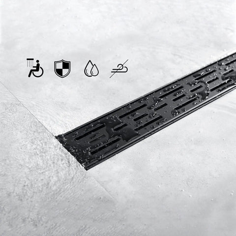 Close-up of 24 Inch Rectangular Matte Black Shower Drain With Removable Brickwork Pattern Grate Brushed 304 Stainless Steel Floor Drain includes Adjustable Leveling Feet And Hair Strainer For No Fuss Install in tile floor
