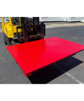 Built Tough As Nails Digital Industrial Floor Scale With 20000 Pound Capacity And 60 By 96 Inch Platform viewed with a forklift.