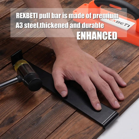 Hand using laminate wood flooring installation kit with tapping block and handle pull bar, double-faced mallet shown.
