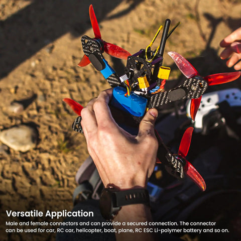 Hands holding a drone with RC Battery Connector Adapters Pack With T Plug EC3 XT30 XT60 Male And Female Adapters attached.
