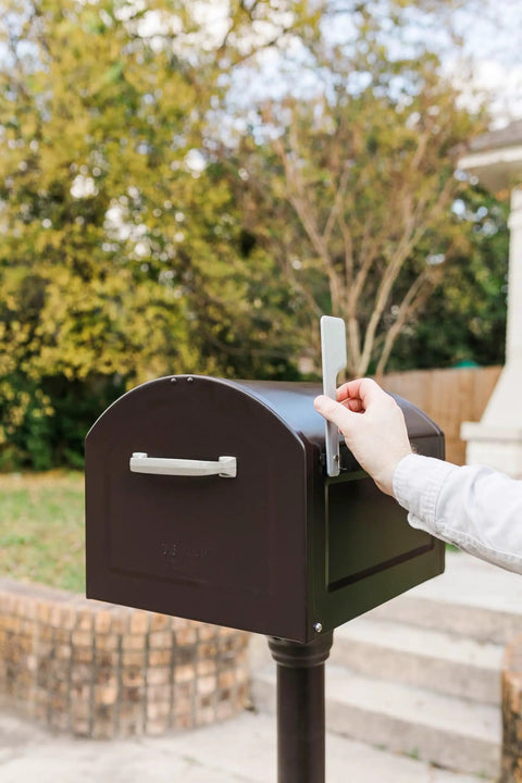 Centennial XL Post Mount Mailbox Rubbed Bronze Weather Tough As Nails Heavy Duty Outdoor Mailbox with open flag being raised