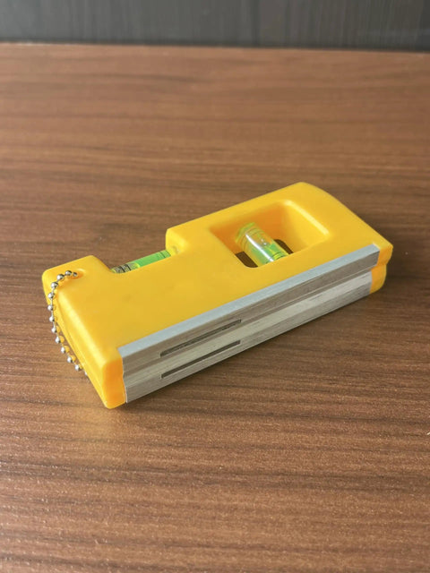 QERDIVO Spirit Levels Mini Horizontal Vertical Pockets Spirit Levels Spirit Bubble Leveler showing yellow pocket-sized design with clear bubble vials.