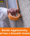 Person applying Heavy Duty Painters Tape Set Six Rolls 1.41 Inch By 60.1 Yard For Vinyl Carpet Metal Plastic Indoor And Outdoor Masking Tape