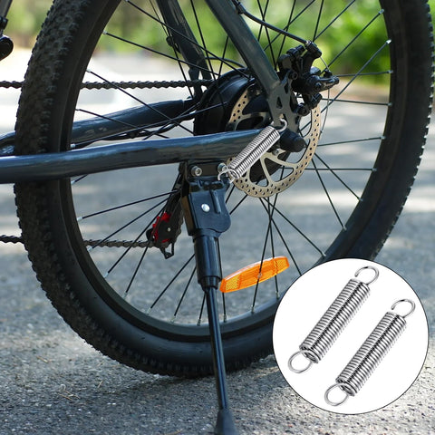 Durable Stainless Steel Extension Springs With Dual Hook Ends on bicycle, reflecting use for quick home repairs and DIY crafts.