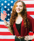 Woman holding 4x6 inch mini American flag in front of large USA flag, Fourth Of July Flags On Sticks 4x6 Inch Mini American USA Flags.